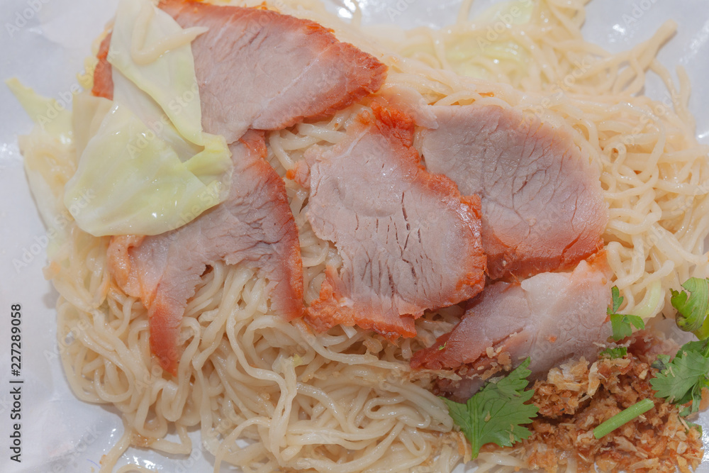 egg noodle soup with red roasted pork in Wrapping Paper egg noodle soup with red roasted pork in Wrapping Paper