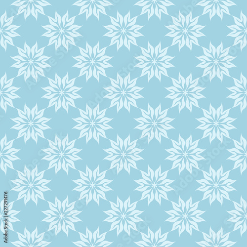 White floral seamless pattern on blue background © Liudmyla