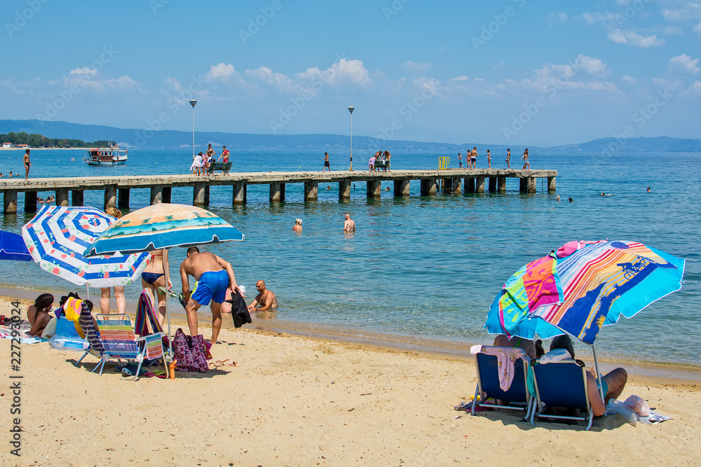 Fototapeta premium Olympiada, Greece - August 18, 2018: Beach of Olimpiada town at Chalkidiki, Greece