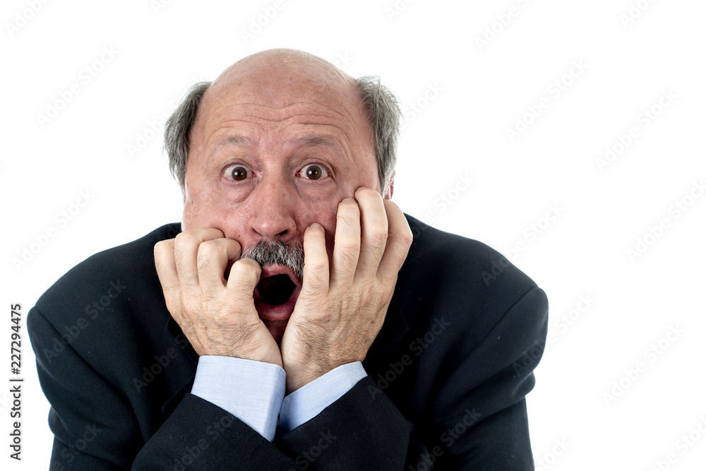 Concern scared shocked older adult man with a terrified facial expression Concern scared shocked older adult man with a terrified facial expression
