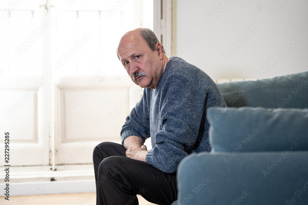Depressed overwhelmed old man feeling exhausted alone and unhappy suffering from depression Depressed overwhelmed old man feeling exhausted alone and unhappy suffering from depression