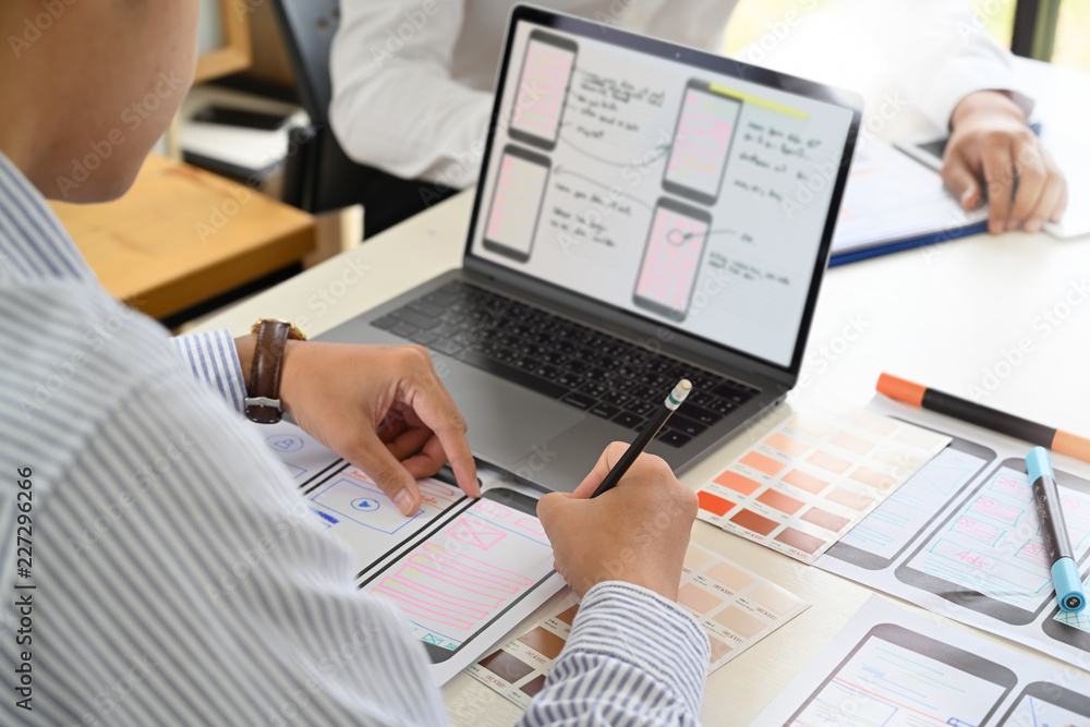 UI Designer drawing website UX layout app development. UI Designer drawing website UX layout app development.