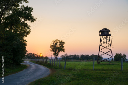 Old water tower on a field