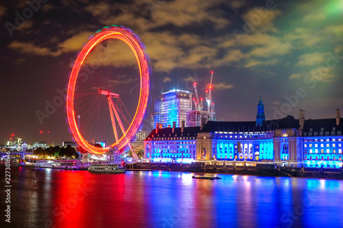 Night scene with light trails on the Westminster bridge. London Eye and County Hall  in London, The United Kingdom of Great Britain.