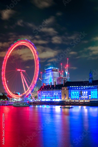 Night scene with light trails on the Westminster bridge. London Eye and County Hall  in London, The United Kingdom of Great Britain.