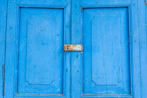 Old wooden door in blue colour.