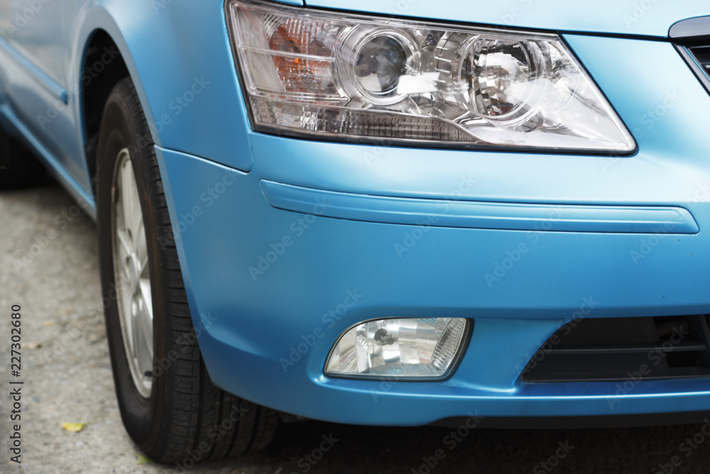 Blue car headlight close-up