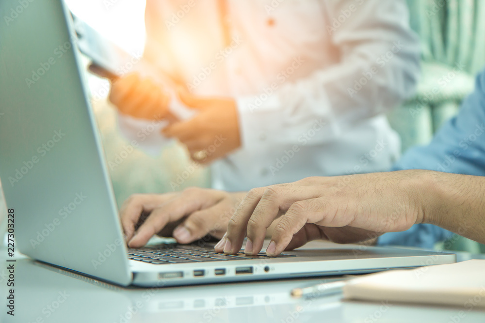Sales promotion ideas, graphs of sales, side views and closed business people use laptops in the morning, Sales promotion ideas, graphs of sales, side views and closed business people use laptops in the morning,