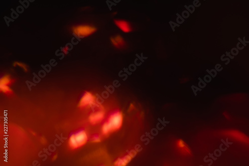 abstract lens flare background. defocused bokeh lights. blur christmas wallpaper decor.