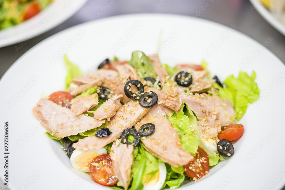 Delicious tuna salad served on white plate Delicious tuna salad served on white plate