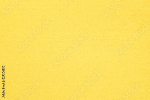 yellow paper texture background. colored cardboard fibers and grain. empty space concept. photo