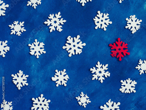 white snowflakes homemade on blue background, winter, place for text