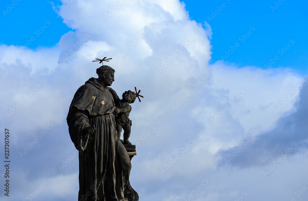 Czech, Prague, gothic sculpture of the Anthony of Padua on the Charles bridge. Prague, medieval art, statue of Saint on the bridge of King Charles. Czech, Prague, gothic sculpture of the Anthony of Padua on the Charles bridge. Prague, medieval art, statue of Saint on the bridge of King Charles.