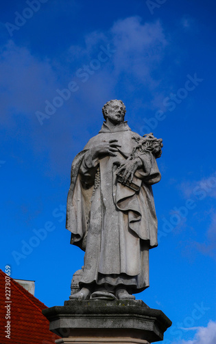 Czech, Prague, gothic sculpture of the of Philip Benizi de Damiani on the Charles bridge. Prague, medieval art, statue of Saint on the bridge of King Charles.