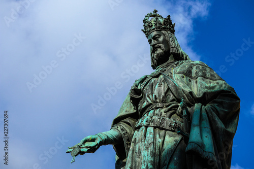 Statue of King Charles  Prague  on a blue sky background. Monument sculpture of the Czech King Charles 4