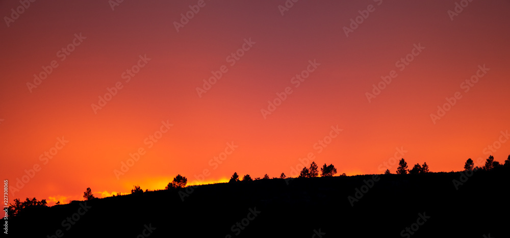 Fototapeta premium Sunset after the mountains high contrast profile