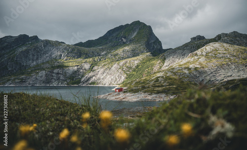 Red hut cottage by a lake o...