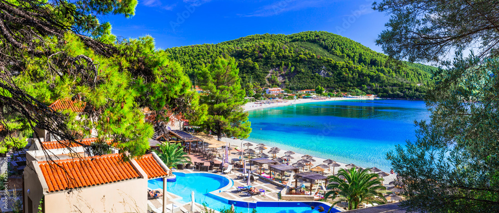 Obraz premium Greek holidays - beautiful Panormos bay. view with hotel and beach. Skopelos island