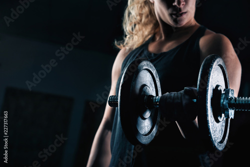 Strong Blonde Woman Lifting Weight
