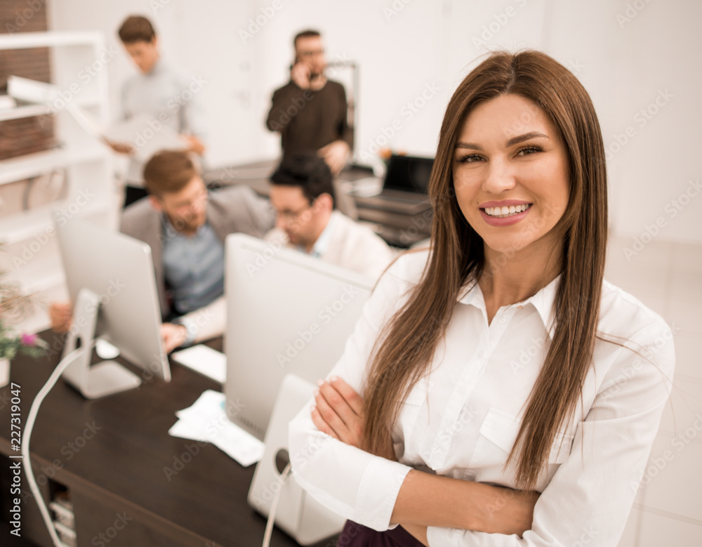 smiling businesswoman standing in a modern office smiling businesswoman standing in a modern office