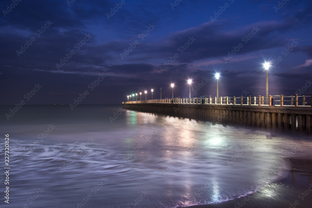 Durban beach in South Africa - Blue Hour - overlooking the Indian ocean. sea waves dancing over the magic sunset light Durban beach in South Africa - Blue Hour - overlooking the Indian ocean. sea waves dancing over the magic sunset light