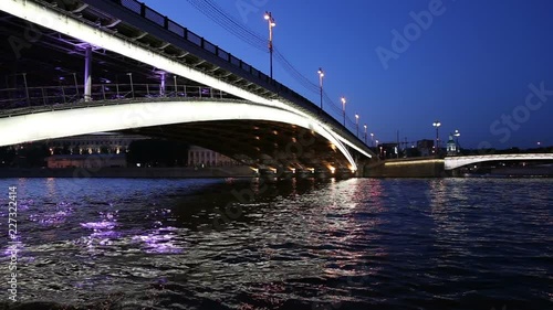 Bolshoy Ustinsky Bridge in Moscow, Russia-- is a steel arch bridge that spans Moskva River near the mouth of Yauza River, connecting the Boulevard Ring with Zamoskvorechye district photo