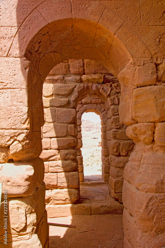 Stone arches which are part of the Royal Tombs, Petra, Jordan.