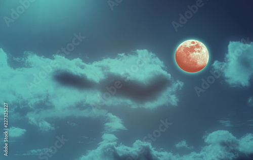 Background of night sky with mysterious clouds and moon eclipse. Moon is taken by me with my camera.