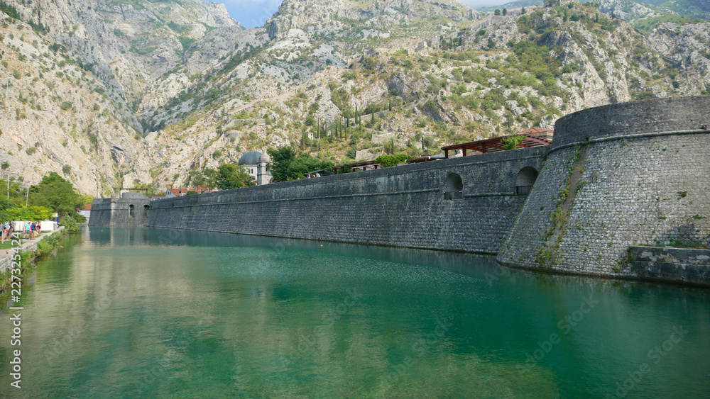 Fototapeta premium The ancient city of Kotor. One of the historic cities of Montenegro with its historic old town, frequent tourist destination, willingly visited by tourists.