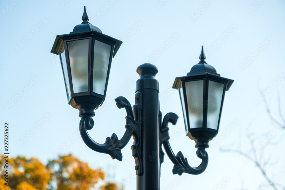 Nighttime antique street lights, old style, autumn time