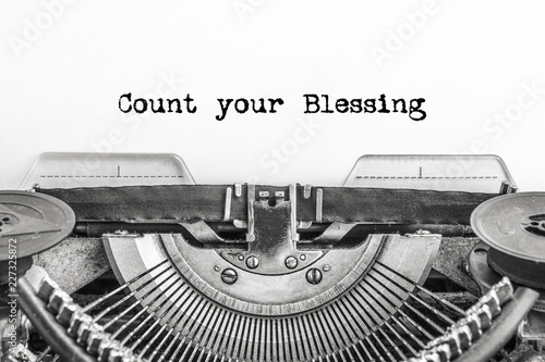 Count your Blessing, the text is typed on a vintage typewriter, in black ink on old paper. close-up