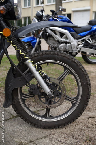 Anti-theft disc brake rotor (the clamp) along with the cable. Motorcycle.