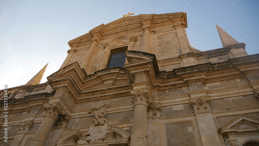 Dubrovnik Cathedral. View from the city walls to the medieval old town, buildings dating from the Middle Ages located by the sea. A frequent place of turistic tours. Dubrovnik Cathedral. View from the city walls to the medieval old town, buildings dating from the Middle Ages located by the sea. A frequent place of turistic tours.