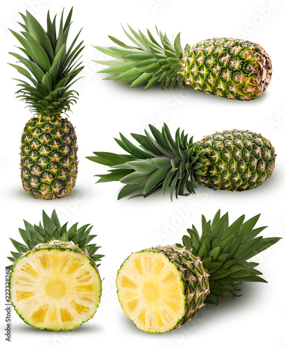 Collection pineapple fruit whole, cut in half with green leaves