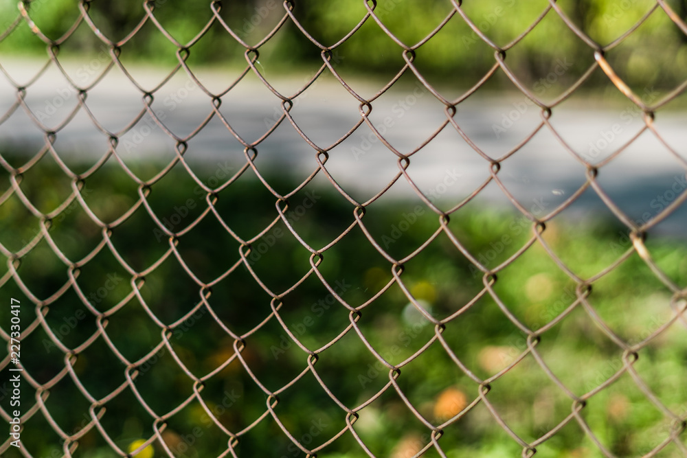 Close up of a old metal fence with shallow depth of field Close up of a old metal fence with shallow depth of field