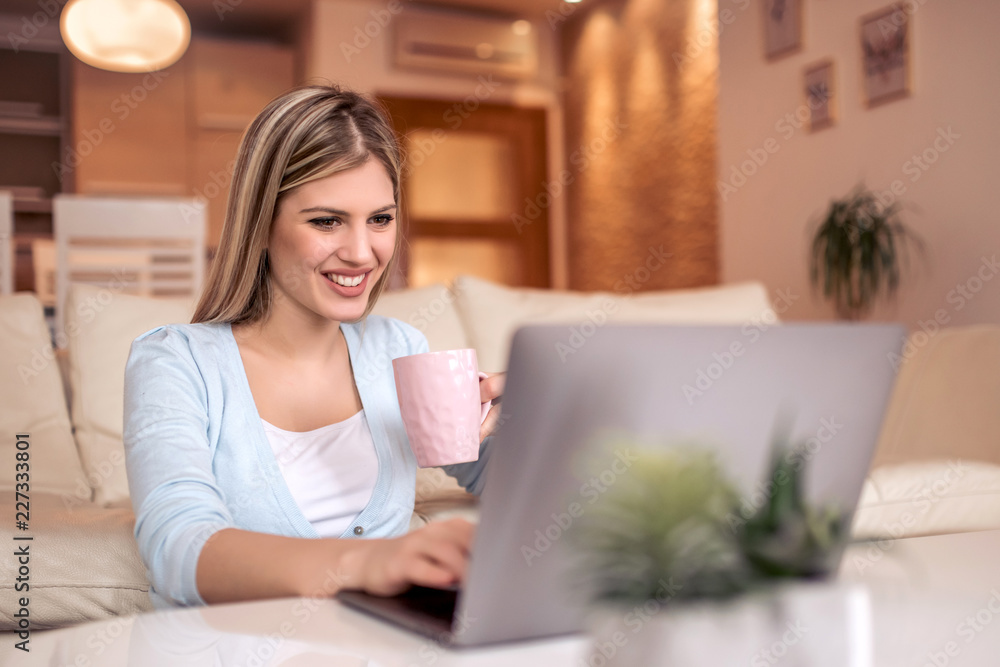 Beautiful young woman working from home Beautiful young woman working from home