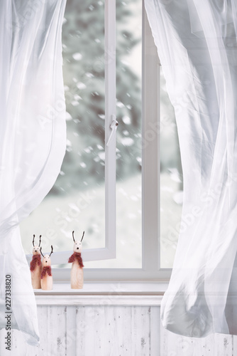 Wooden Reindeers Sitting In Window