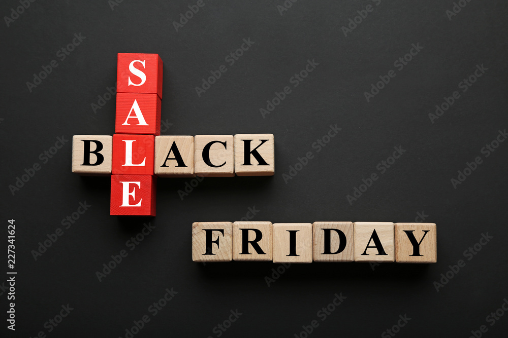 Obraz premium Wooden toy cubes with inscription Black Friday and Sale