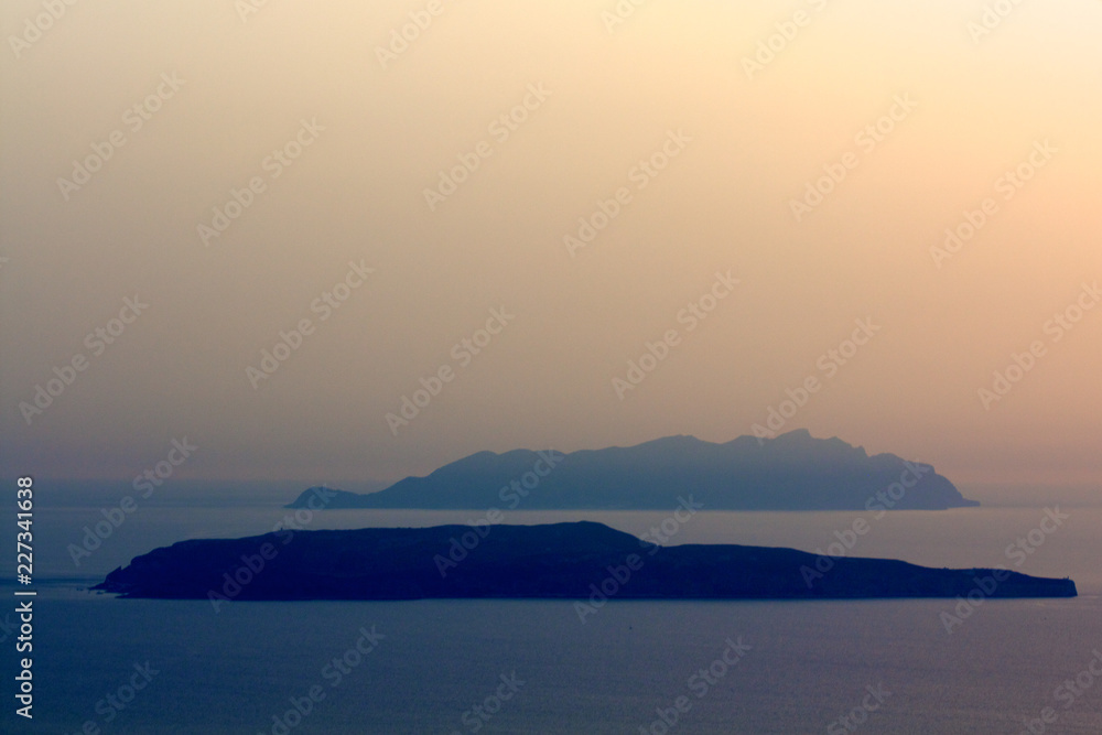 Fototapeta premium Islands in the mist at sunset
