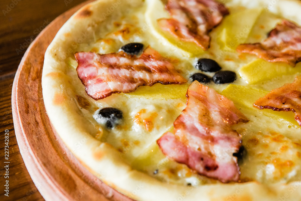 delicious pizza with meat, cheese and mushrooms delicious pizza with meat, cheese and mushrooms