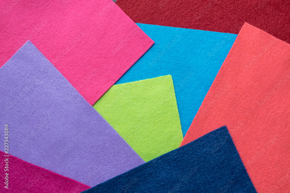 Samples of soft felt flaps in different colours. Fan of colored bright felt textile material. Felt craft abstract handicraft background for handmade and creative. Abstract Pop Art Background Samples of soft felt flaps in different colours. Fan of colored bright felt textile material. Felt craft abstract handicraft background for handmade and creative. Abstract Pop Art Background