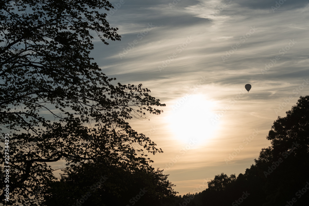 sunset with a view of a hot air balloon sunset with a view of a hot air balloon