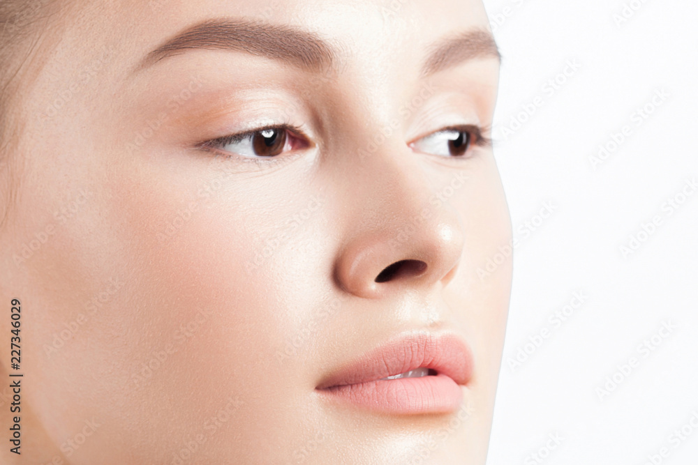 Fototapeta premium Young beautiful woman with clean perfect skin close-up