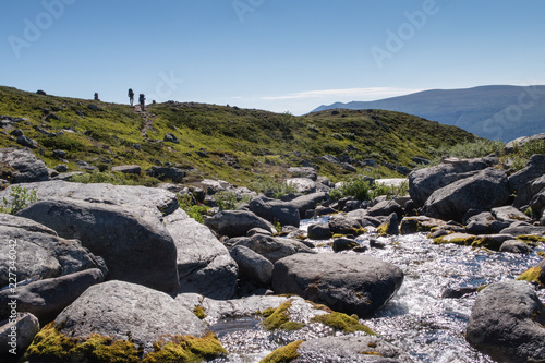 hikers on the trail between Pårte and Aktse in northern sweden © Per