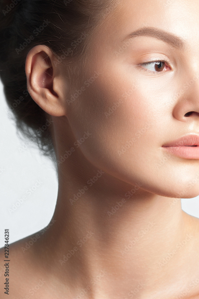 Young beautiful woman with clean perfect skin close-up Young beautiful woman with clean perfect skin close-up