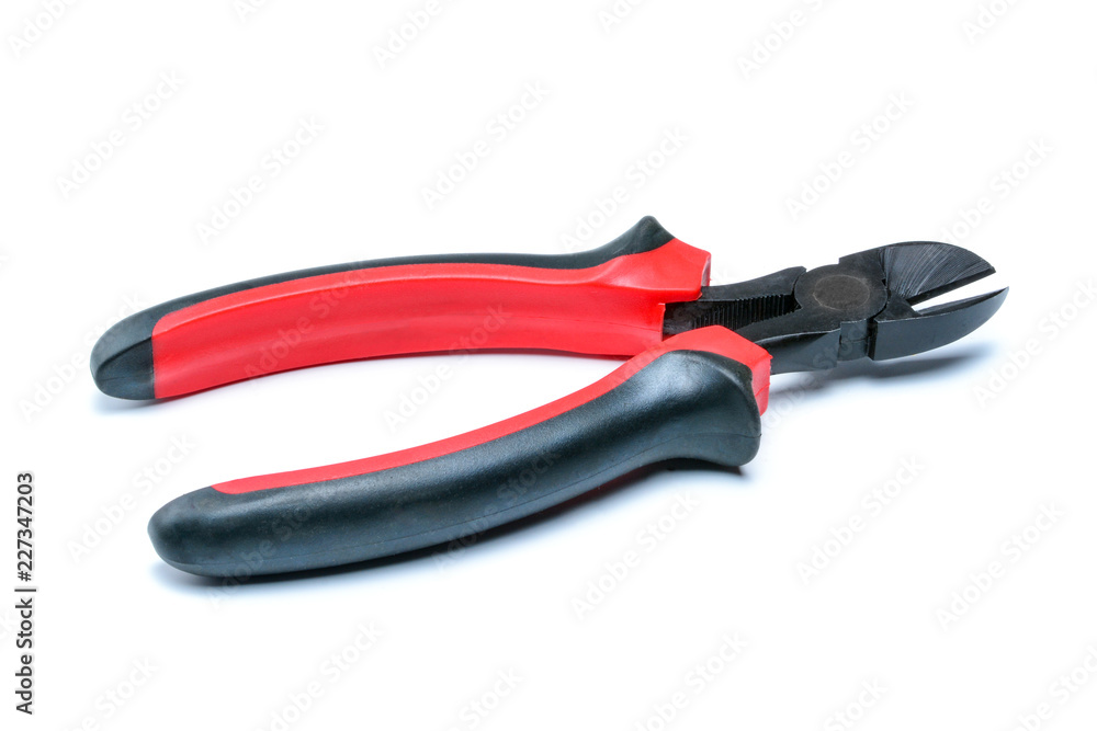 Side cutters with black and red isolated handles on white background. Tool isolated on white with clipping path. Side cutters with black and red isolated handles on white background. Tool isolated on white with clipping path.