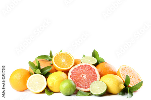 Citrus fruits with green leafs isolated on white background