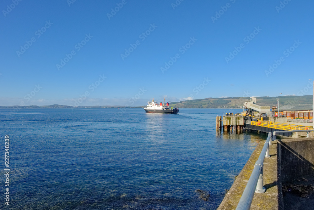 car ferry leaving Wemyss bay pier on the river Clyde