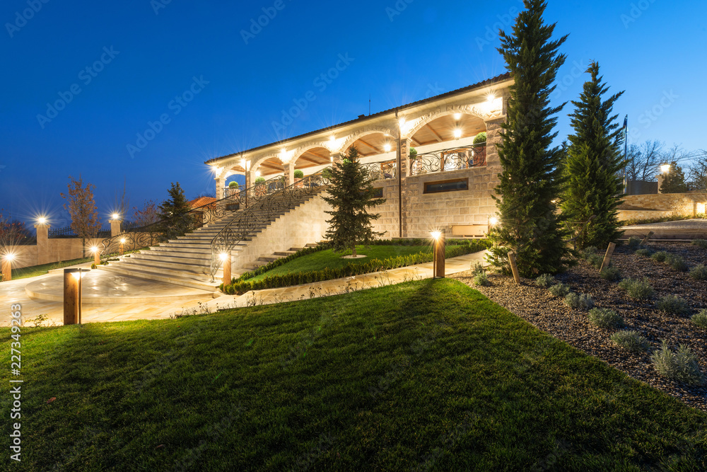 Fototapeta premium Exterior of rustic house, villa by night