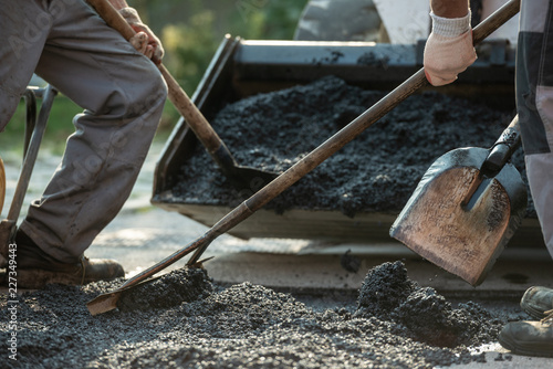 Workers  making new asphalt pavement photo